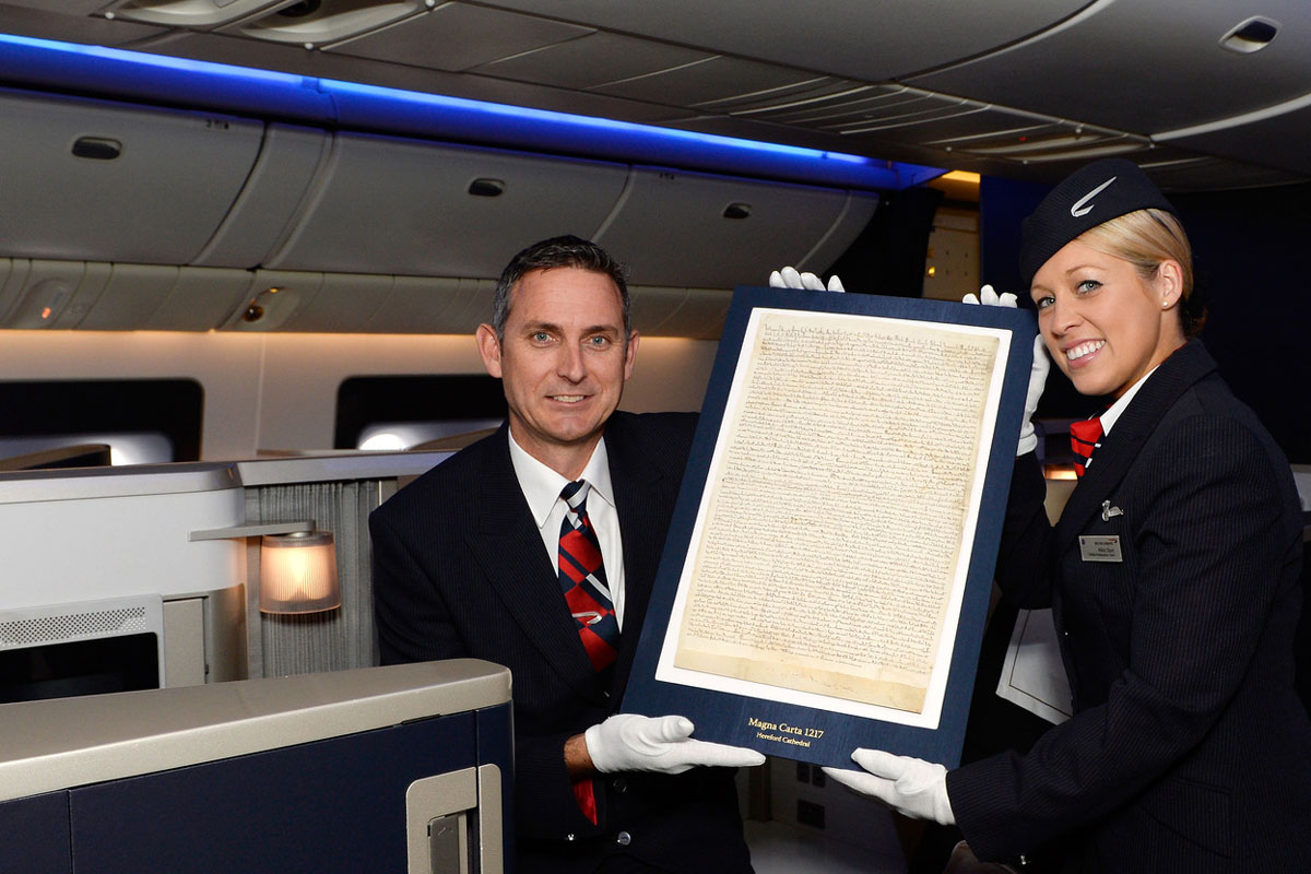 BA crew members with the 800-year-old Magna Carta on board. Photograph from British Airways